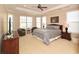 Relaxing main bedroom with tray ceiling, plush carpet, and a seating area for unwinding at 221 Aster Ct, Canton, GA 30114