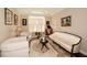Cozy sitting room with neutral tones, plush seating, and an elegant area rug at 221 Aster Ct, Canton, GA 30114