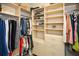 Organized walk-in closet with shelving, drawers, and hanging rods for ample storage space at 221 Aster Ct, Canton, GA 30114
