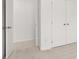 Bedroom with double door closet and neutral carpeting at 281 Kenoot Dr # 36, Mcdonough, GA 30253