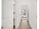 Light-filled entryway with wood floors, crisp white doors, and a glimpse of the exterior at 281 Kenoot Dr # 36, Mcdonough, GA 30253