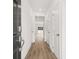 Bright entryway featuring wood-look flooring, neutral walls, and a view of the living area at 281 Kenoot Dr # 36, Mcdonough, GA 30253