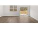 Bright Gathering room with sliding glass door leading to backyard patio at 281 Kenoot Dr # 36, Mcdonough, GA 30253