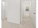 Hallway with neutral carpet featuring multiple doors and closets at 281 Kenoot Dr # 36, Mcdonough, GA 30253
