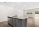 Modern kitchen island with granite countertop and gray cabinets at 281 Kenoot Dr # 36, Mcdonough, GA 30253