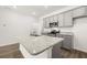 Modern kitchen with gray cabinets, granite countertops, and stainless steel appliances at 281 Kenoot Dr # 36, Mcdonough, GA 30253