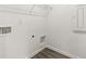 Laundry room with vinyl flooring, overhead shelving, and utility hookups at 281 Kenoot Dr # 36, Mcdonough, GA 30253