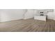 Spacious living room featuring wood floors, white walls, and natural light at 281 Kenoot Dr # 36, Mcdonough, GA 30253