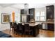 Modern kitchen with dark cabinetry, granite island, and stainless steel appliances at 334 Greenwood Ave, Decatur, GA 30030