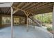 Covered basement patio with access to the backyard at 580 Meadows Creek Dr, Johns Creek, GA 30005