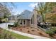 Home exterior featuring a spacious deck, garage and a well-manicured lawn at 580 Meadows Creek Dr, Johns Creek, GA 30005