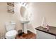 Powder room with pedestal sink and toilet at 11119 Torino Dr, Hampton, GA 30228