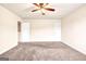 Spacious bedroom with neutral walls and carpet at 11119 Torino Dr, Hampton, GA 30228