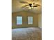 Spacious bedroom with neutral walls, ceiling fan, and bright natural light at 11119 Torino Dr, Hampton, GA 30228