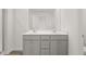 Modern bathroom with double vanity and walk-in shower at 261 Kenoot Dr # 41, Mcdonough, GA 30253