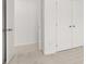 Large bedroom closet with double doors and shelving at 261 Kenoot Dr # 41, Mcdonough, GA 30253