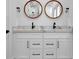 Double vanity bathroom with marble countertops at 3060 Cabernet Ct, Cumming, GA 30041