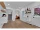 Bright entryway with hardwood floors, built-in shelving, and a view to the dining room at 3060 Cabernet Ct, Cumming, GA 30041