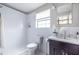 Bright bathroom featuring tile shower, modern vanity, and updated fixtures at 410 Candler Park Ne Dr # C-1, Atlanta, GA 30307