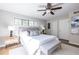 Bright bedroom with ceiling fan, ensuite bath, and hardwood floors at 410 Candler Park Ne Dr # C-1, Atlanta, GA 30307