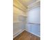 Walk-in closet features customizable shelving and hardwood floors at 410 Candler Park Ne Dr # C-1, Atlanta, GA 30307