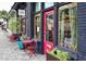 Charming storefront with red door, vintage signage and sidewalk seating at 410 Candler Park Ne Dr # C-1, Atlanta, GA 30307