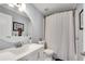 Cozy bathroom with modern fixtures, a round mirror, and a shower with curtain at 54 Basswood Cir, Atlanta, GA 30328