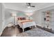 Bright bedroom with hardwood floors, neutral walls, ceiling fan, and decorative shelving at 54 Basswood Cir, Atlanta, GA 30328