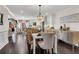 Open dining room showcases dark wood floors, elegant chandelier and seamless flow to living spaces at 54 Basswood Cir, Atlanta, GA 30328