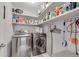 Laundry room with modern washer, dryer, and shelving at 54 Basswood Cir, Atlanta, GA 30328