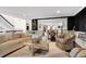 Open-concept living room flows into dining area, featuring dark hardwood floors at 54 Basswood Cir, Atlanta, GA 30328