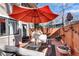 Inviting patio space with ample seating, an umbrella, and outdoor decor at 54 Basswood Cir, Atlanta, GA 30328