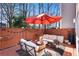 Cozy patio with stylish outdoor furniture, string lights, and a relaxing atmosphere at 54 Basswood Cir, Atlanta, GA 30328