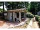 Picnic area with a covered seating area next to a tennis court at 54 Basswood Cir, Atlanta, GA 30328