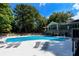 Community pool with lounge chairs and a spacious deck, ideal for summer enjoyment at 54 Basswood Cir, Atlanta, GA 30328