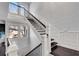 Elegant staircase featuring dark wood steps, white risers, and detailed trim at 54 Basswood Cir, Atlanta, GA 30328