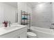 Bathroom featuring marble tile accents, modern vanity, bathtub, and sleek fixtures for comfortable living at 1611 Saddlegate Dr, Canton, GA 30114