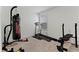 Well-equipped home gym featuring a punching bag, treadmill, and weight training equipment for fitness at 1611 Saddlegate Dr, Canton, GA 30114