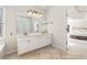 Double vanity bathroom with view into main bedroom at 179 Waterstone Pt, Acworth, GA 30101