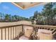 Deck overlooking the golf course with comfortable seating at 179 Waterstone Pt, Acworth, GA 30101