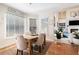 Bright dining area with wood table and neutral chairs at 179 Waterstone Pt, Acworth, GA 30101