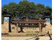 Community entrance with stone pillars and arbor at 179 Waterstone Pt, Acworth, GA 30101