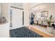 Bright entryway with hardwood floors, dining area, and rug at 179 Waterstone Pt, Acworth, GA 30101
