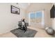 Home gym with recumbent bike and plenty of natural light at 179 Waterstone Pt, Acworth, GA 30101