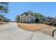 Curved driveway leading to a two-story brick home at 179 Waterstone Pt, Acworth, GA 30101