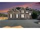 Brick house with a large front yard and landscaping at 179 Waterstone Pt, Acworth, GA 30101