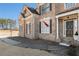 Brick house with dark brown front door and landscaping at 179 Waterstone Pt, Acworth, GA 30101