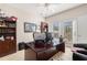 Home office with built-in shelving and hardwood floors at 179 Waterstone Pt, Acworth, GA 30101