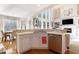Kitchen island with sink, dishwasher, and breakfast bar at 179 Waterstone Pt, Acworth, GA 30101