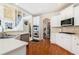 Spacious kitchen with double oven, island, and hardwood floors at 179 Waterstone Pt, Acworth, GA 30101